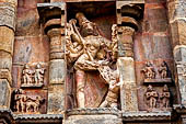 The great Chola temples of Tamil Nadu - The Airavatesvara temple of Darasuram. Figure of deity framed in niche on the north wall of the sanctuary, (Bhairava with six arms with his dog behind him) 